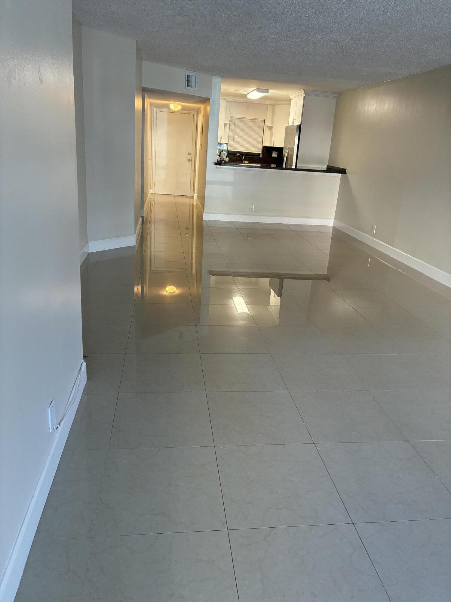 2955 Riverside Drive, Unit 103 Coral Springs, FL 33065 - Photo 3 of 26 a view of a living room with a sink