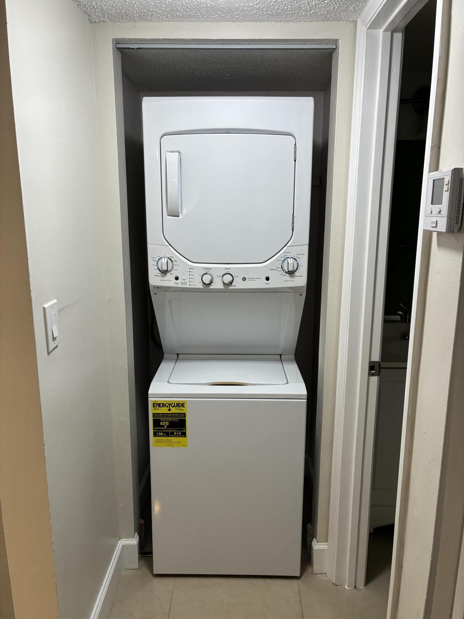 2955 Riverside Drive, Unit 103 Coral Springs, FL 33065 - Photo 9 of 26 a close up view of a washer and dryer