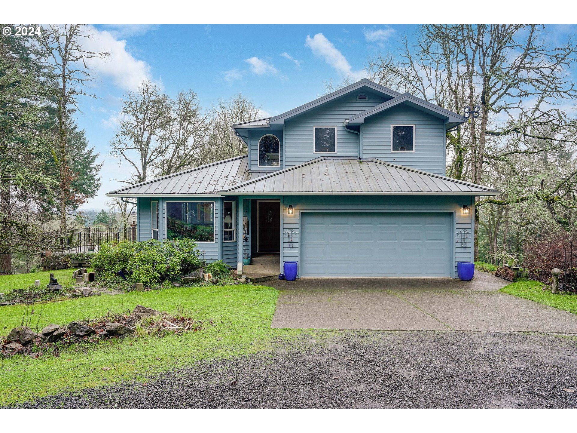 2080 Cherry Knoll Road Dallas, OR 97338 - Photo 1 of 48 a front view of a house with a yard and garage