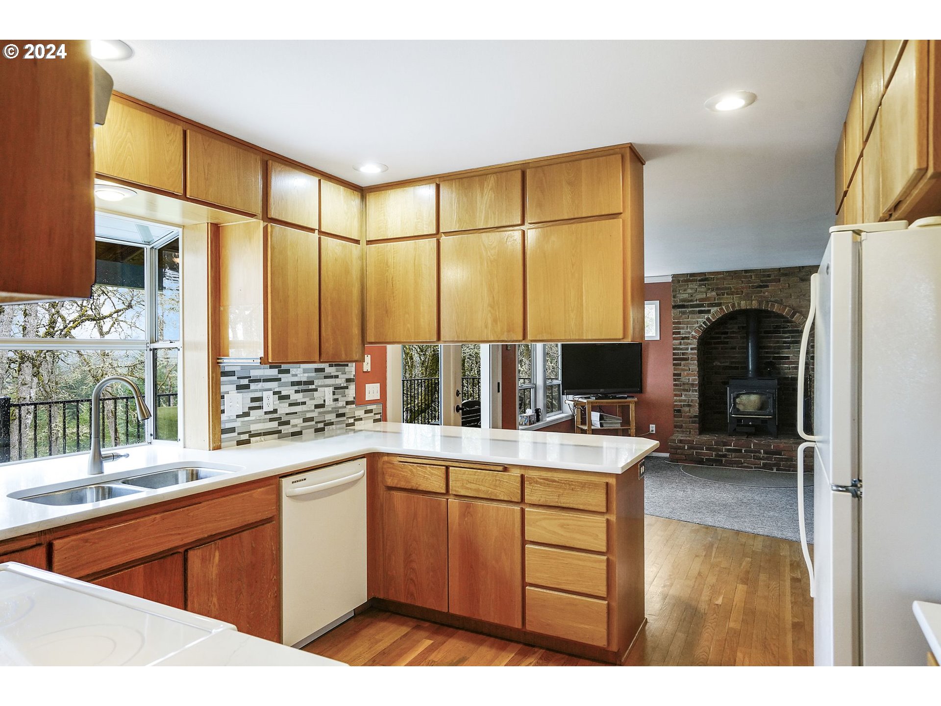 2080 Cherry Knoll Road Dallas, OR 97338 - Photo 12 of 48 a kitchen with a sink stove and cabinets