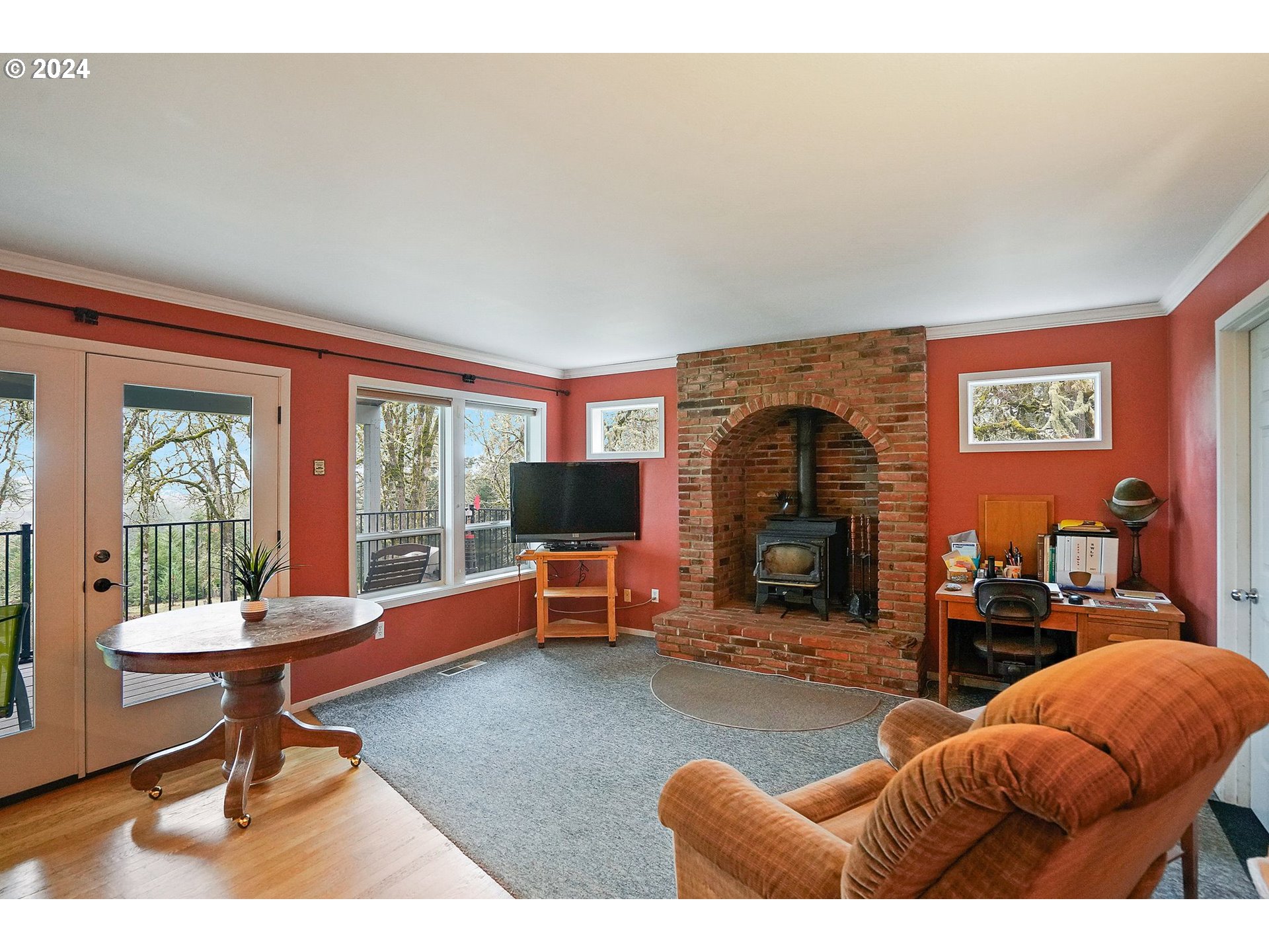 2080 Cherry Knoll Road Dallas, OR 97338 - Photo 17 of 48 a living room with furniture a window and a fireplace