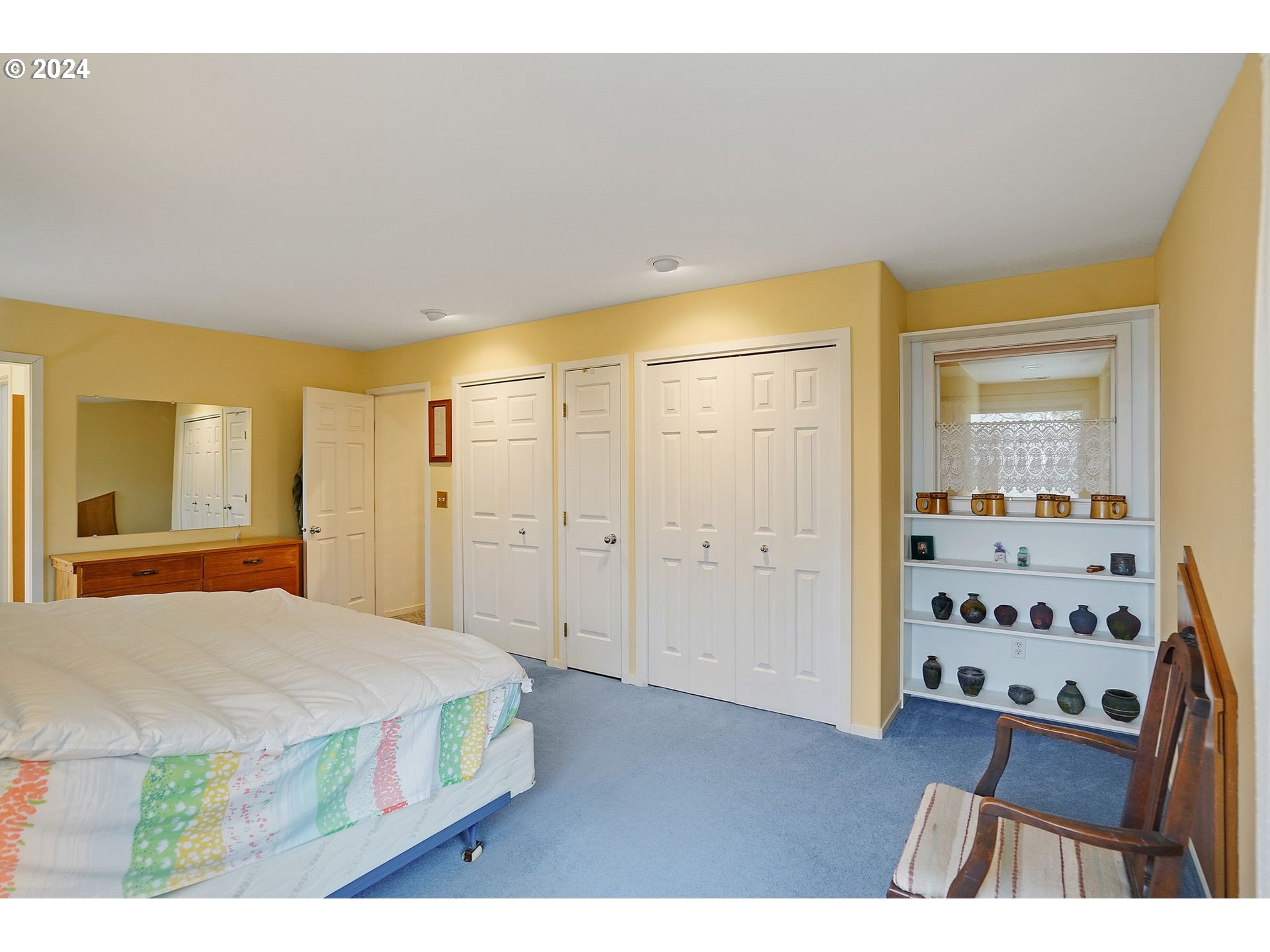 2080 Cherry Knoll Road Dallas, OR 97338 - Photo 20 of 48 a bedroom with a bed and wooden floor