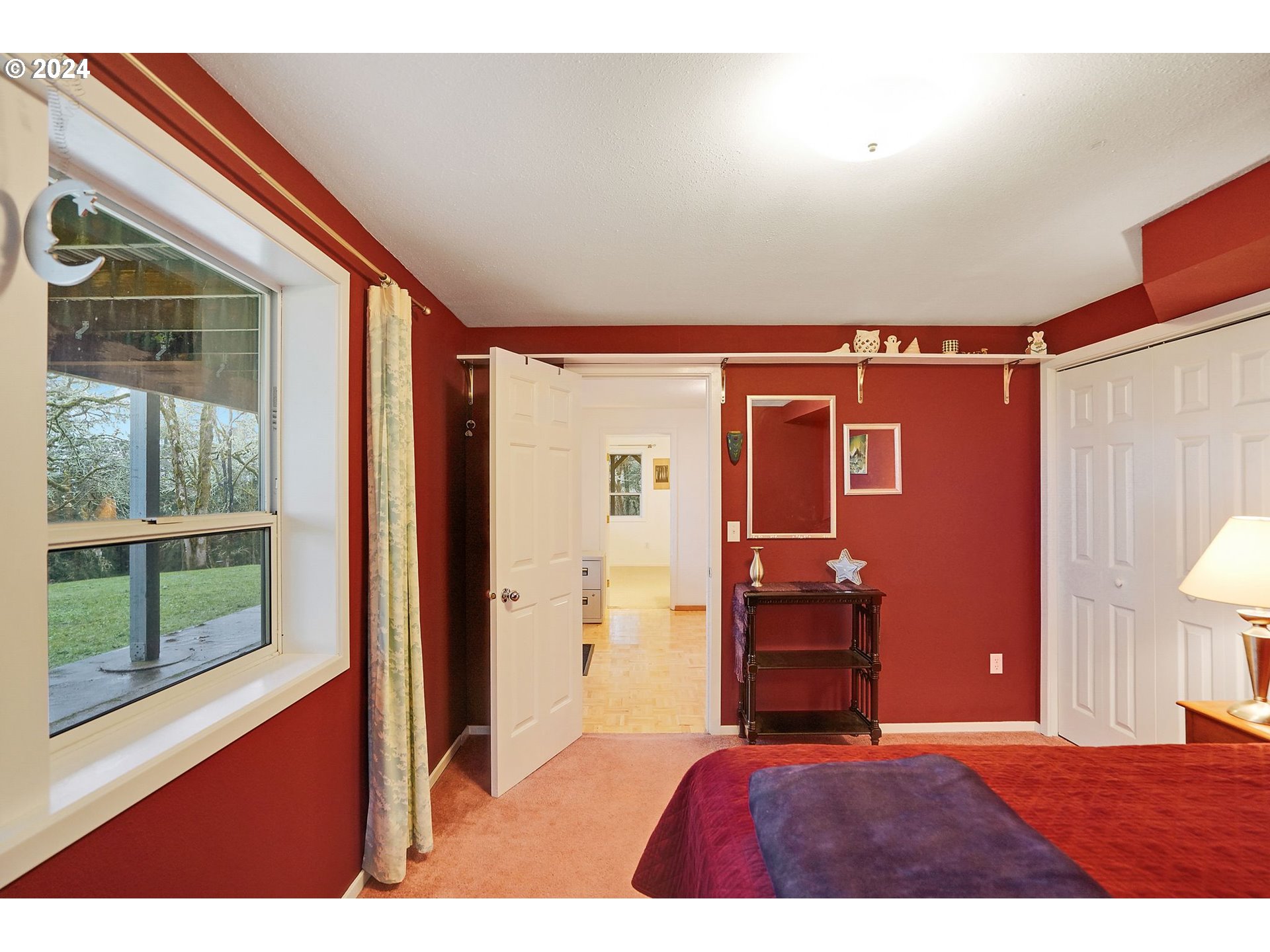 2080 Cherry Knoll Road Dallas, OR 97338 - Photo 29 of 48 a bedroom with a bed and a large window