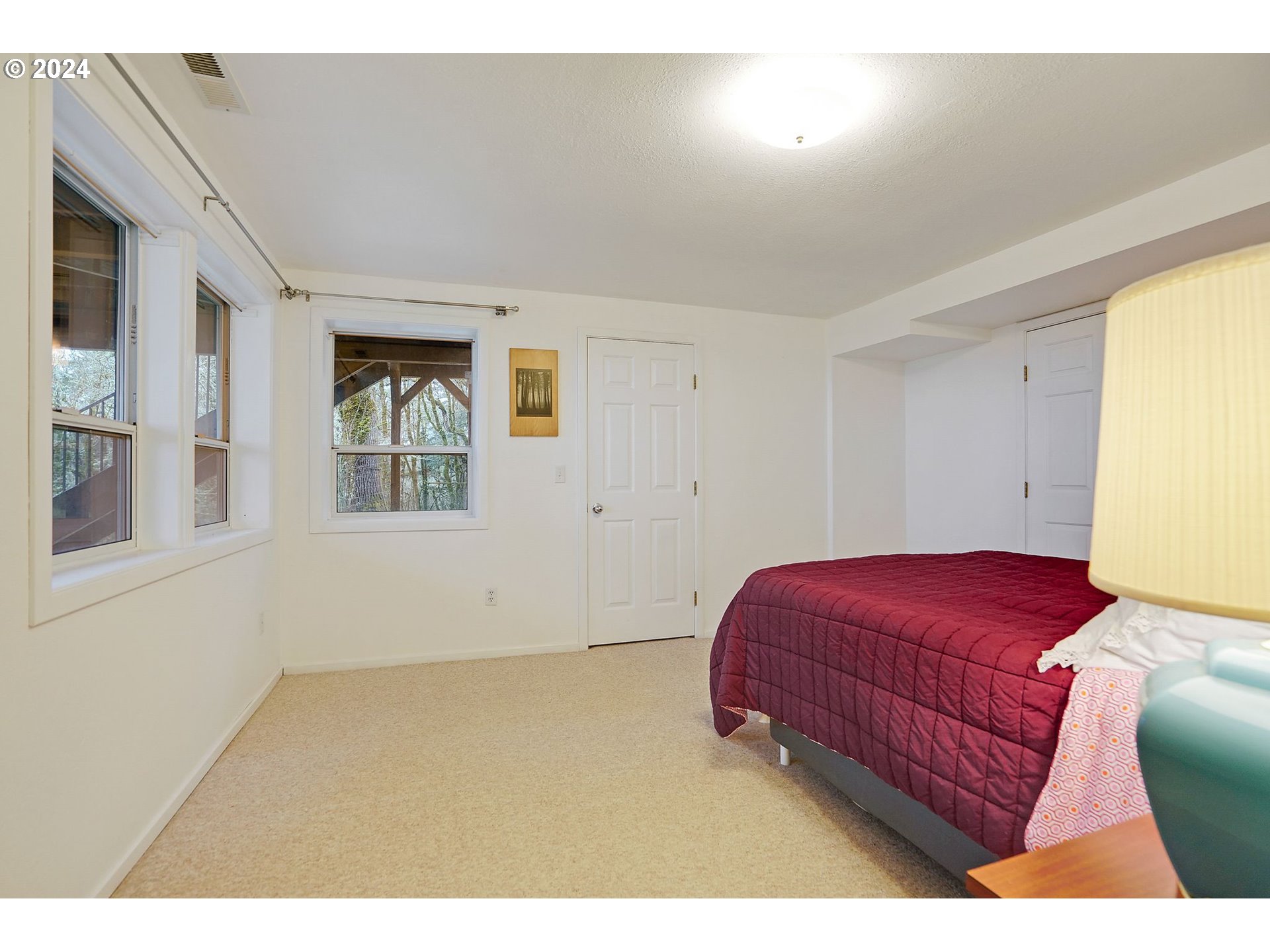 2080 Cherry Knoll Road Dallas, OR 97338 - Photo 30 of 48 a bedroom with a bed and a window