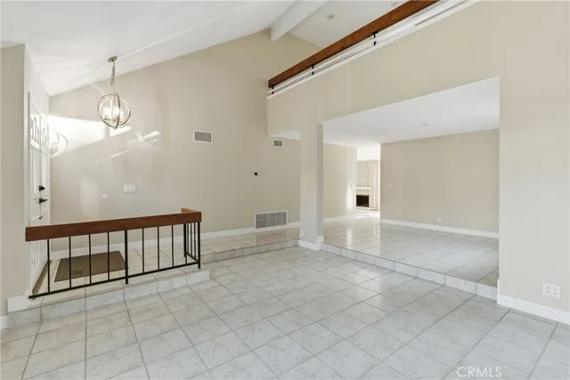 a view of a livingroom with wooden floor and a flat screen tv