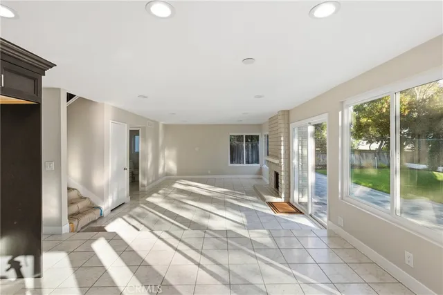 a view of an empty room with glass windows