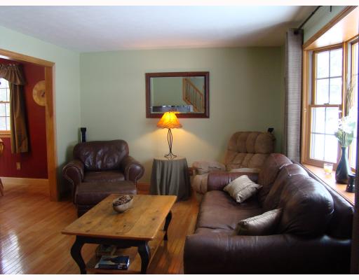 23 Robin Way Westerly, RI 02891 - Photo 2 of 12 Living Room. Loads of light from the bay window sparkes onto the hardwood floors