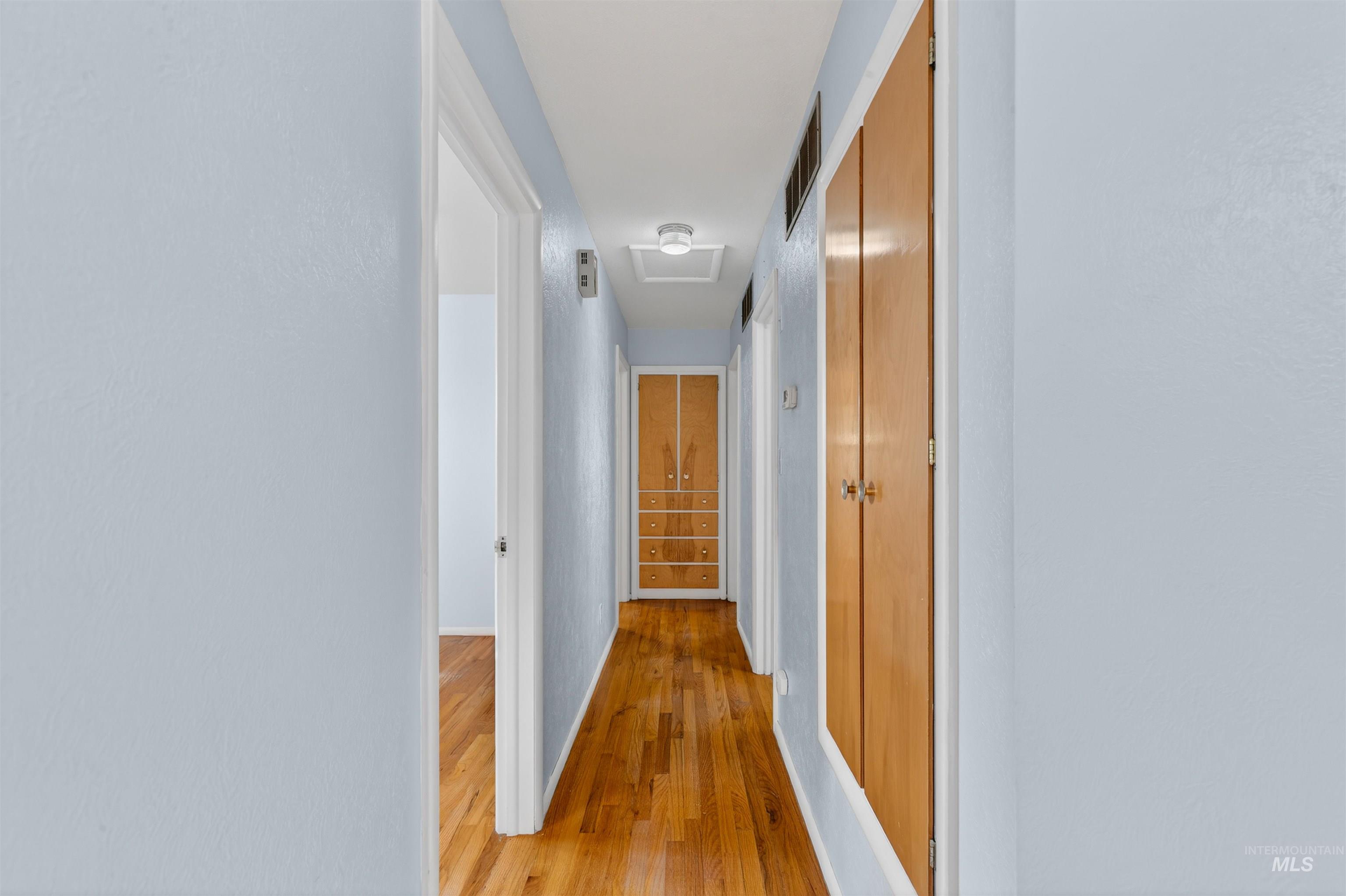 609 Grelle Avenue Lewiston, ID 83501 - Photo 16 of 48 Corridor with light wood finished floors and attic access