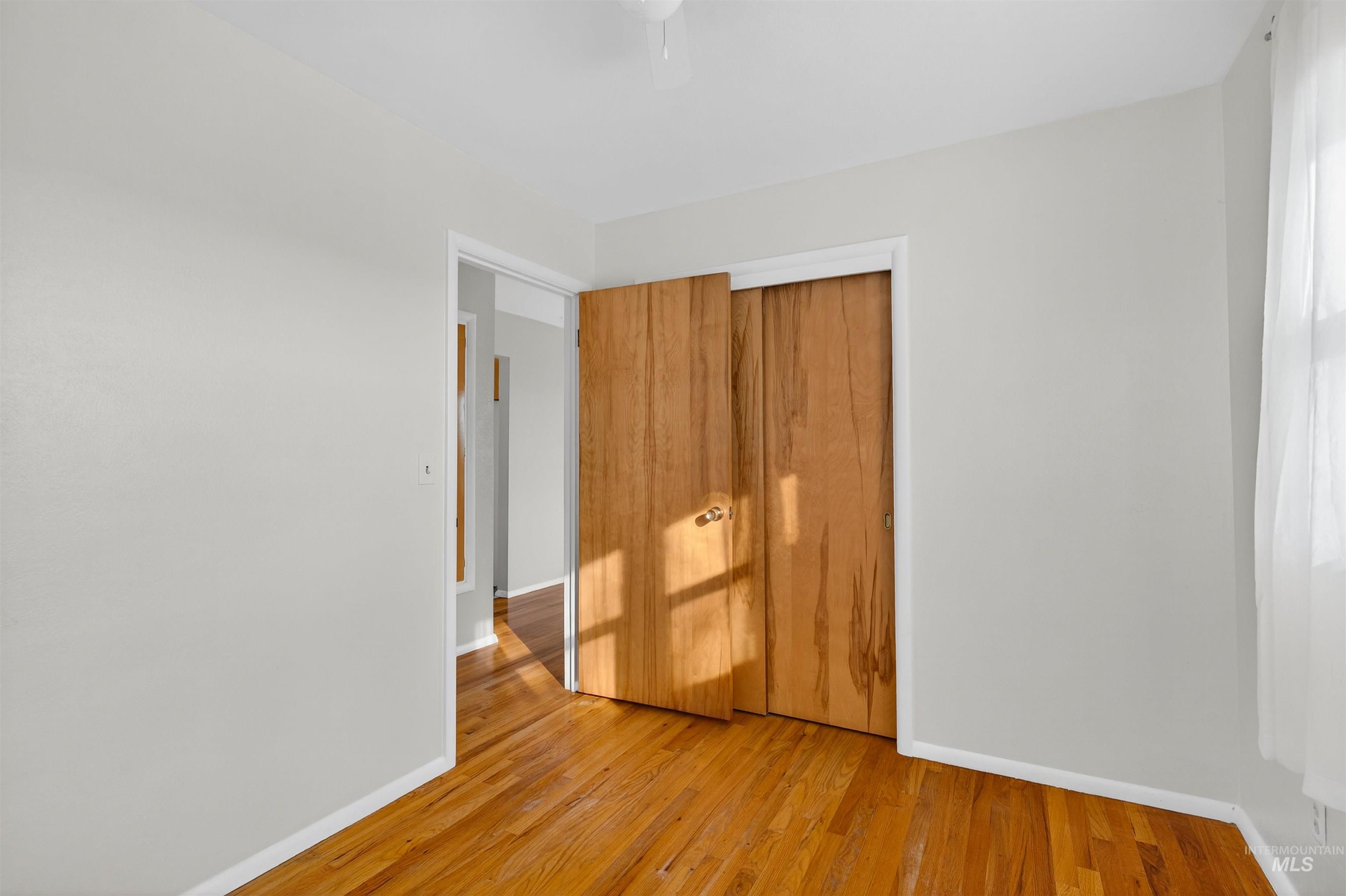 609 Grelle Avenue Lewiston, ID 83501 - Photo 17 of 48 Unfurnished bedroom with a closet, light wood finished floors, and a ceiling fan