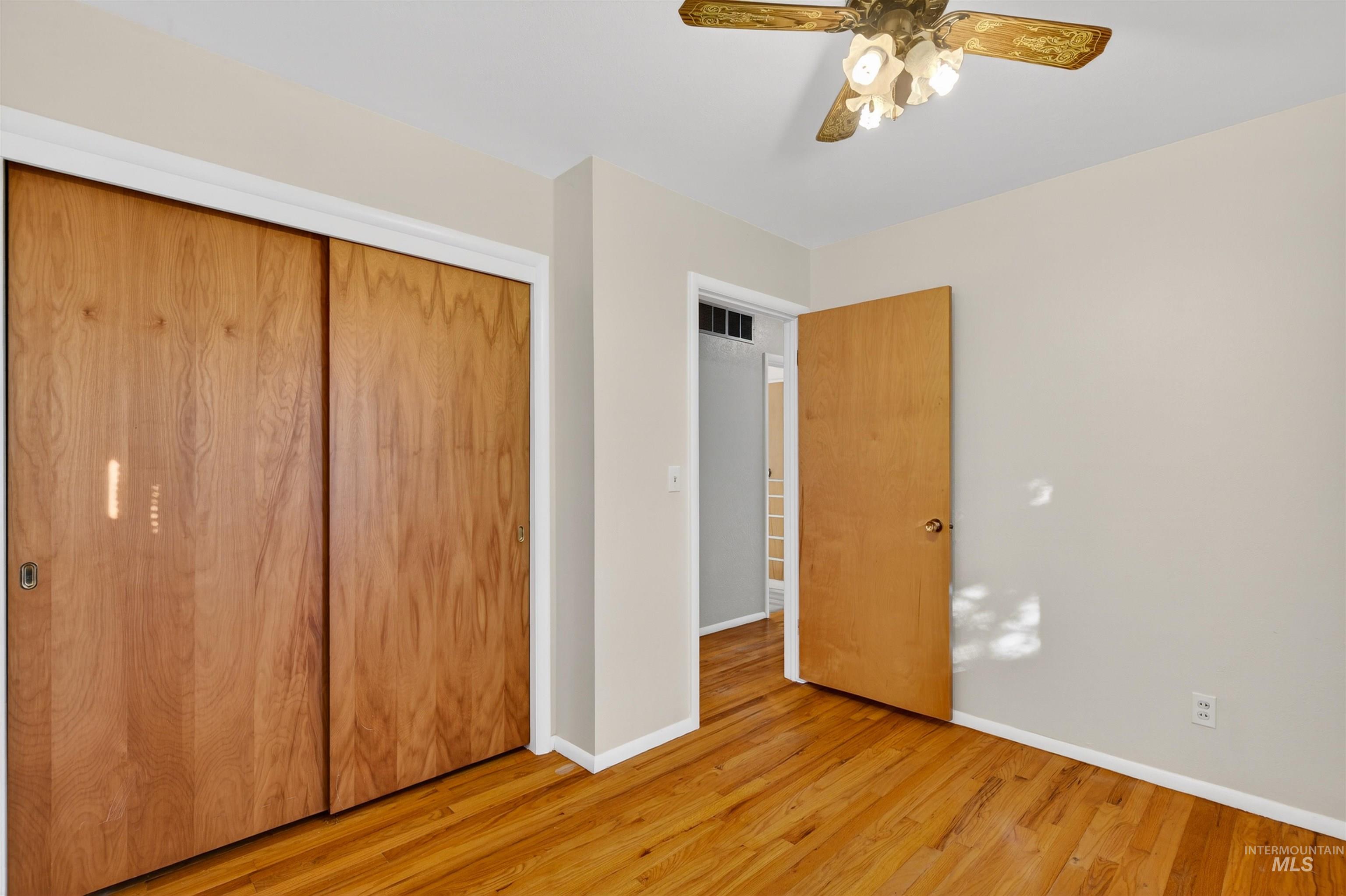 609 Grelle Avenue Lewiston, ID 83501 - Photo 18 of 48 Unfurnished bedroom with a closet, light wood finished floors, and a ceiling fan