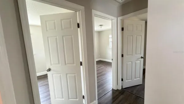 wooden floor with white cabinet