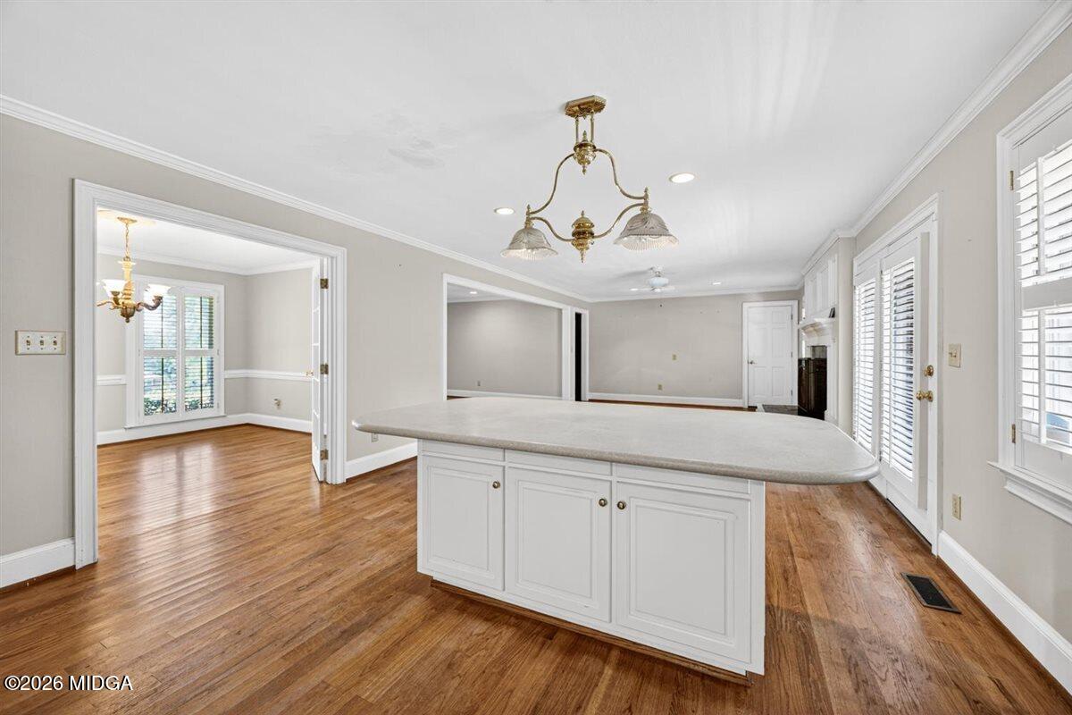 335 Hamrick Road Macon, GA 31220 - Photo 12 of 41 a view of a kitchen with wooden floor electronic appliances and windows