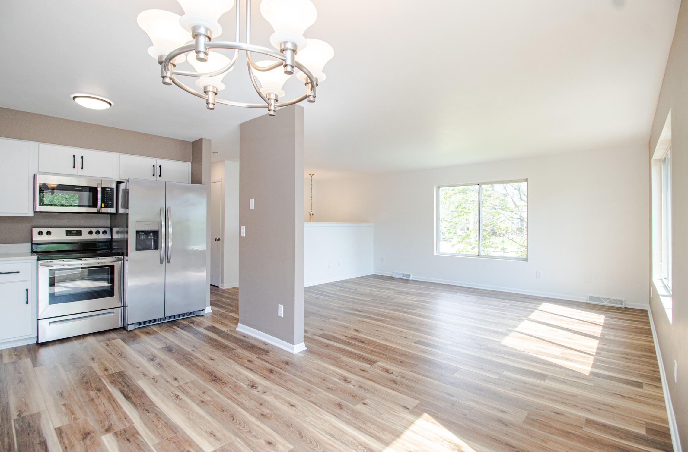 1410 South River Road New Berlin, WI 53151 - Photo 14 of 41 Kitchen and Living Room