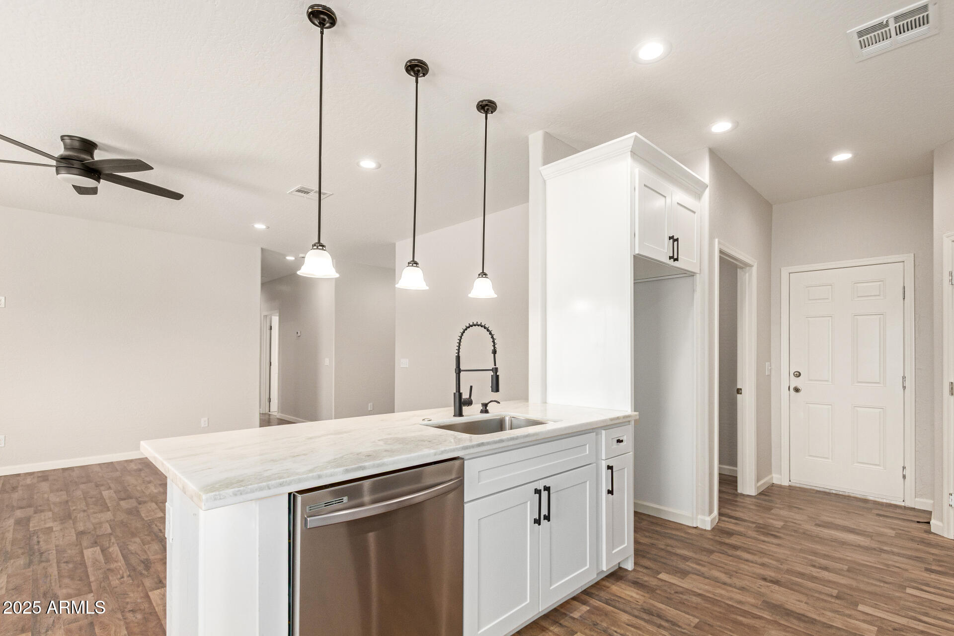 15941 South Animas Road Arizona City, AZ 85123 - Photo 11 of 26 a bathroom with a double vanity sink a mirror and a shower