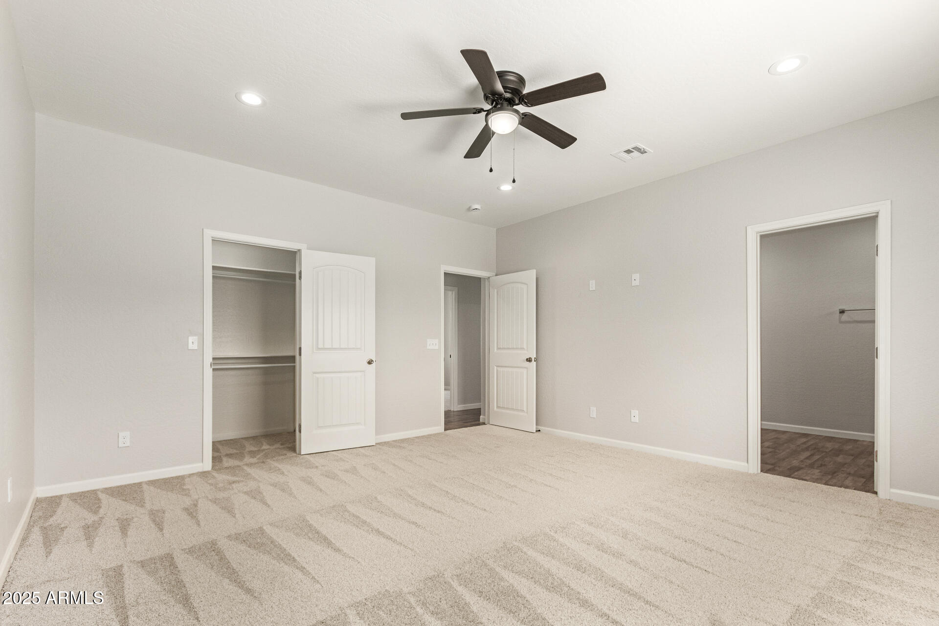 15941 South Animas Road Arizona City, AZ 85123 - Photo 13 of 26 a view of a livingroom with a ceiling fan & entryway