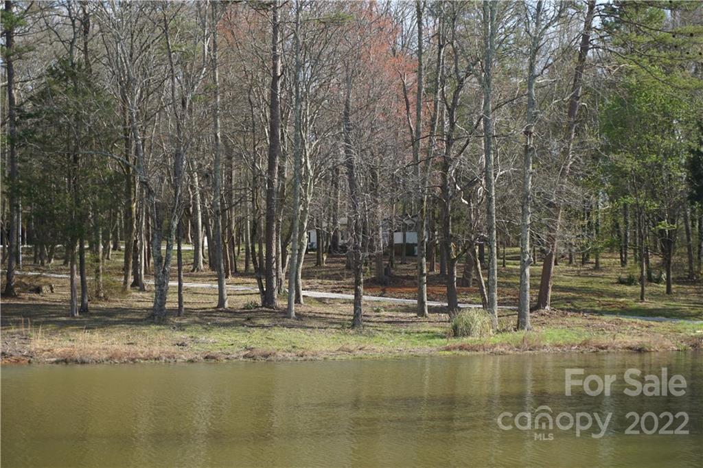 1293 Hines Road Clover, SC 29710 - Photo 3 of 33 a swimming pool with trees in the background