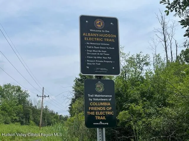a view of a park with welcome board