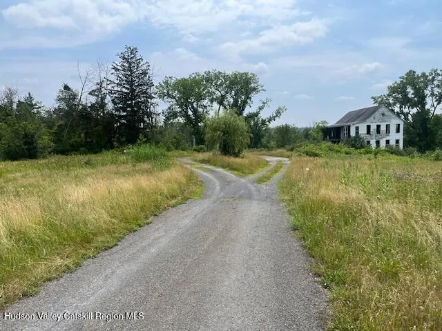 a view of a road with a yard