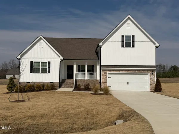 a front view of a house with a garage