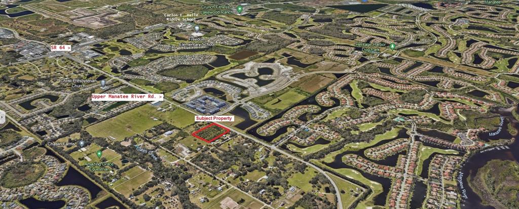 Upper Manatee River Road Northeast Bradenton, FL 34212 - Photo 3 of 3 view of a yard