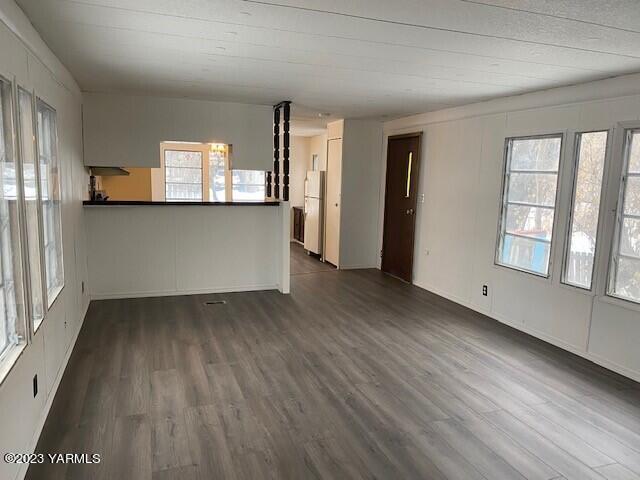 814 Washington Street Tieton, WA 98947 - Photo 2 of 7 a view of empty room with wooden floor and fan