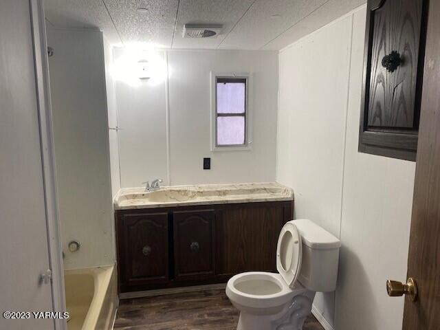 814 Washington Street Tieton, WA 98947 - Photo 4 of 7 a bathroom with a toilet a sink and mirror