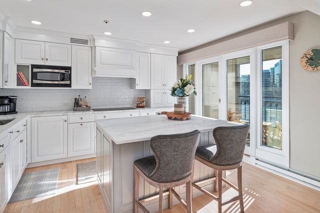 a view of a chairs and table in a balcony