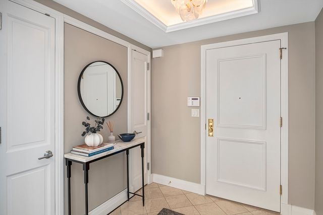 a view of a hallway with wooden floor and entryway