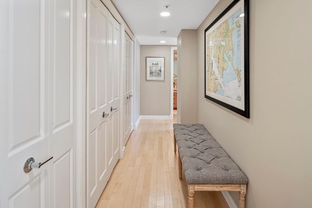 a bed sitting in a bedroom and flat screen tv