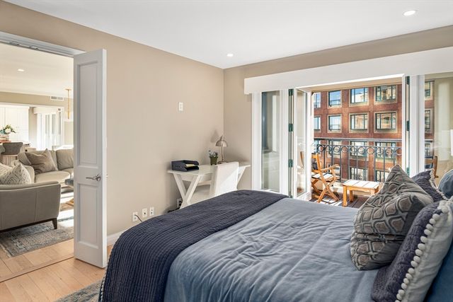 a view of a chairs and table in a balcony