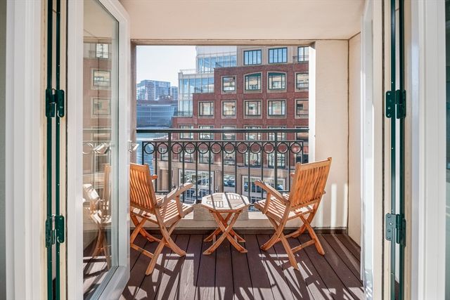 a bathroom with a shower sink vanity and toilet