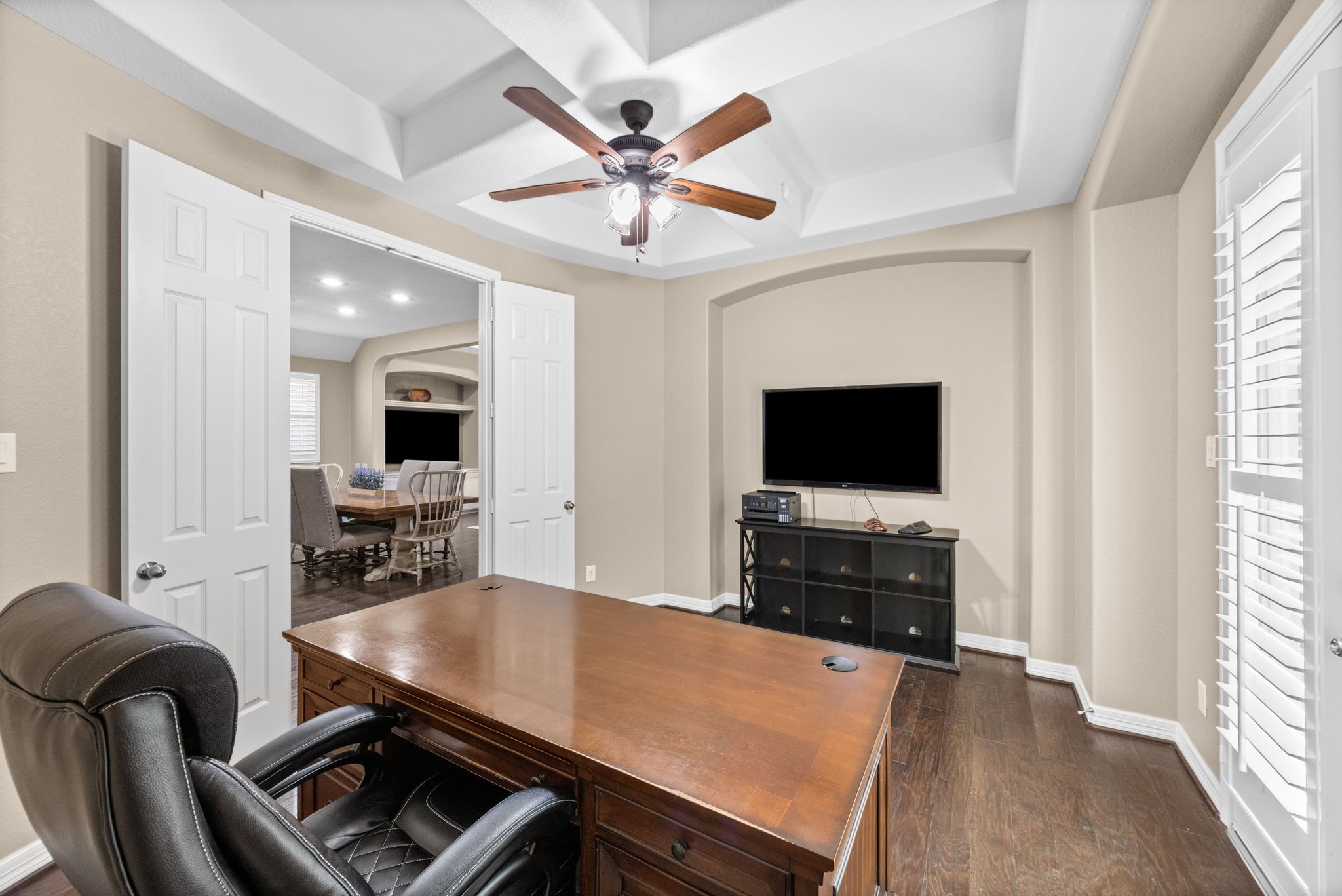 27642 Linden Ridge Lane Fulshear, TX 77441 - Photo 13 of 42 This view of the Home Office showcases a spacious layout with ample room for furniture placement, built-in niches, and flexible use options. It’s ideal for a TV, shelving, or additional office essentials, offering both functionality and comfort in a well-designed workspace.