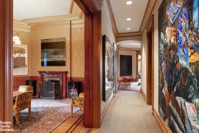 a living room with fireplace furniture and a window