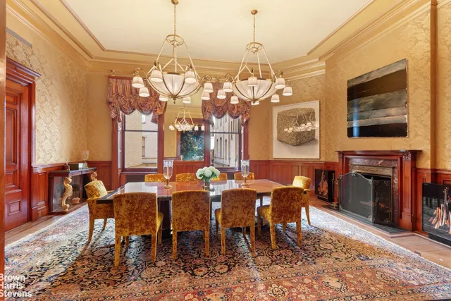a dining room with furniture a rug and wooden floor