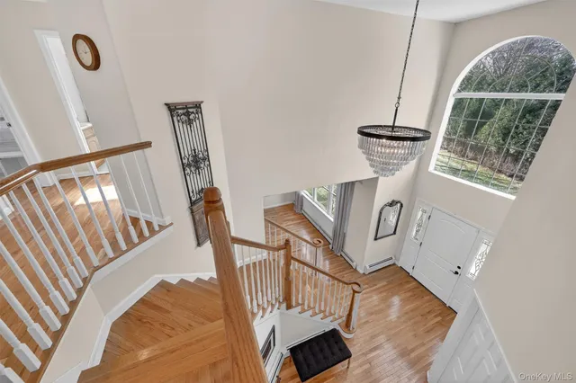 a view of an entryway with wooden floor