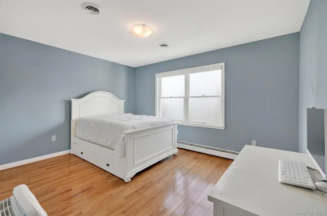 a room with a bed and a window