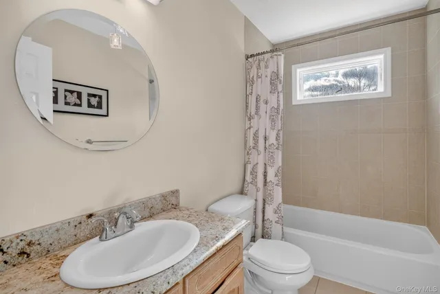 a bathroom with a toilet a sink and bathtub