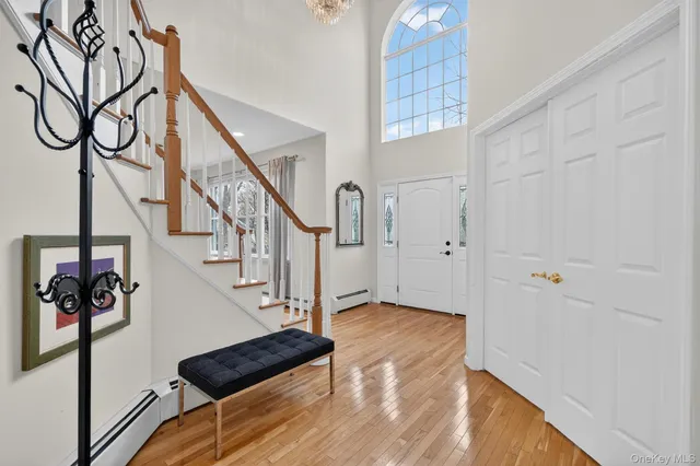 a view of an entryway with wooden floor