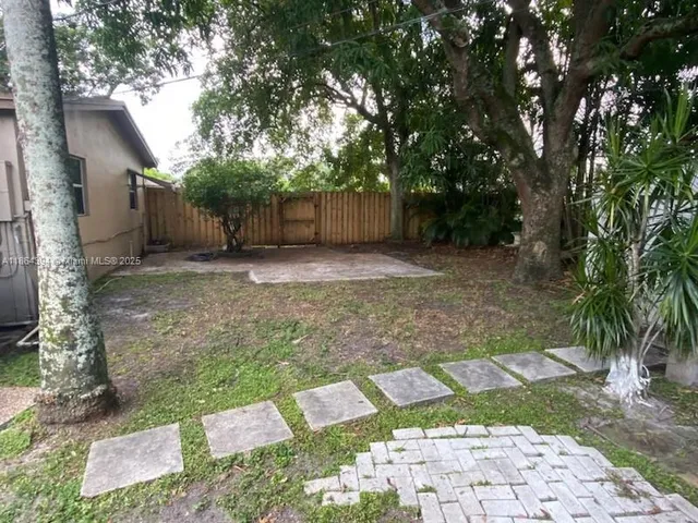 a kitchen with a sink and a stove