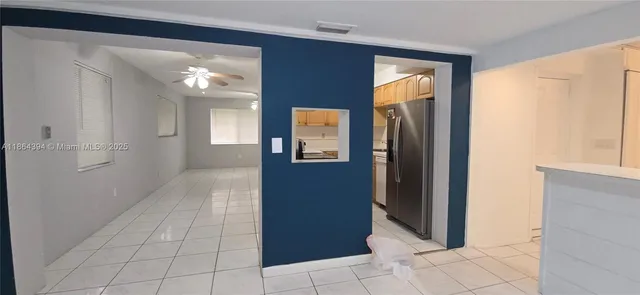 a view of a chandelier fan in a room