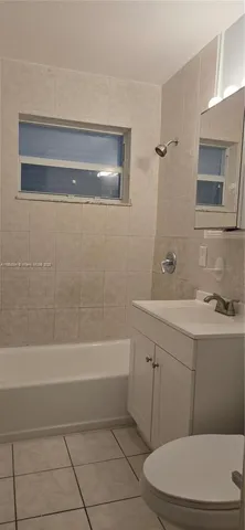 a view of kitchen with livingroom and window