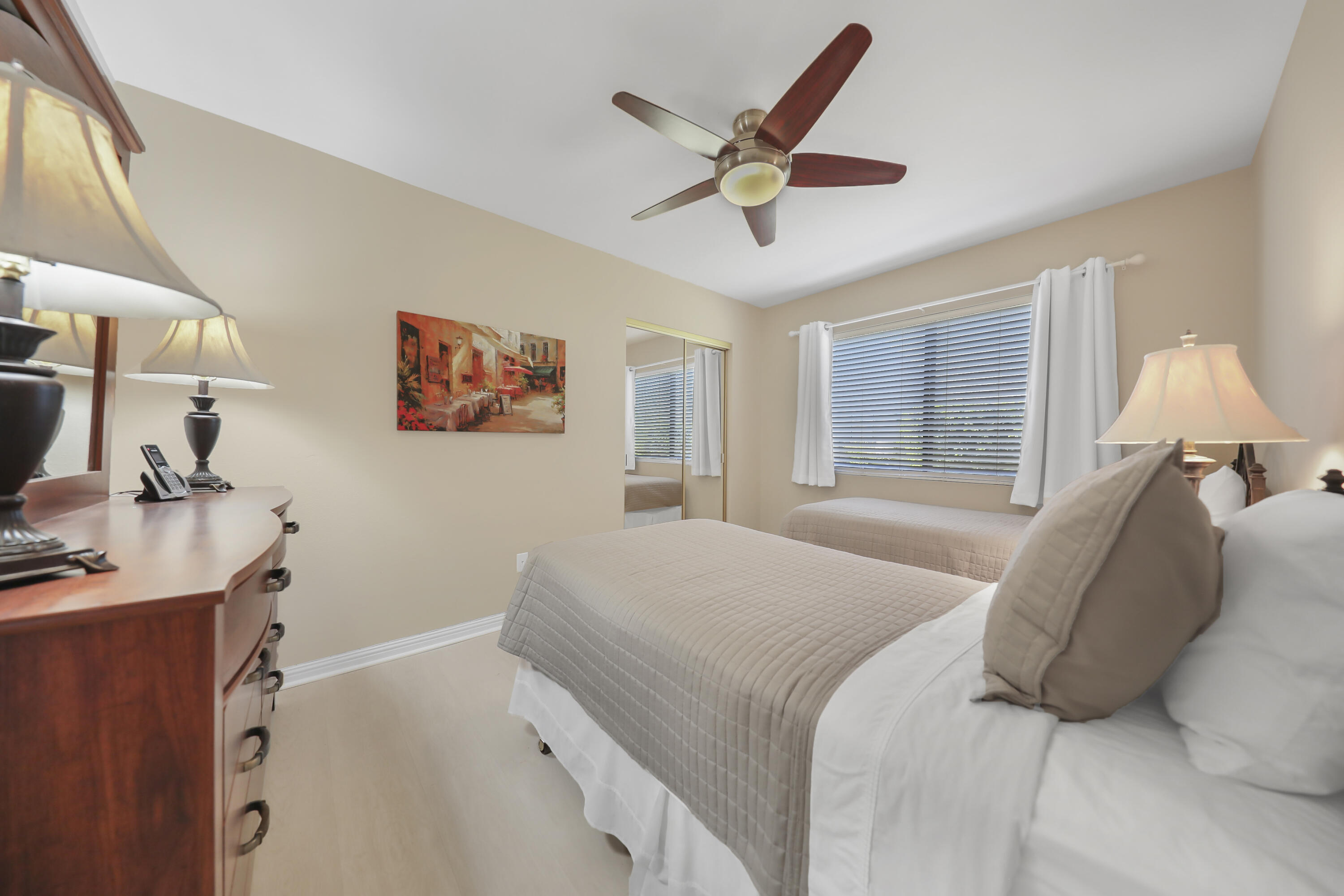41476 Inverness Way Palm Desert, CA 92211 - Photo 15 of 37 a bedroom with a bed and a large window