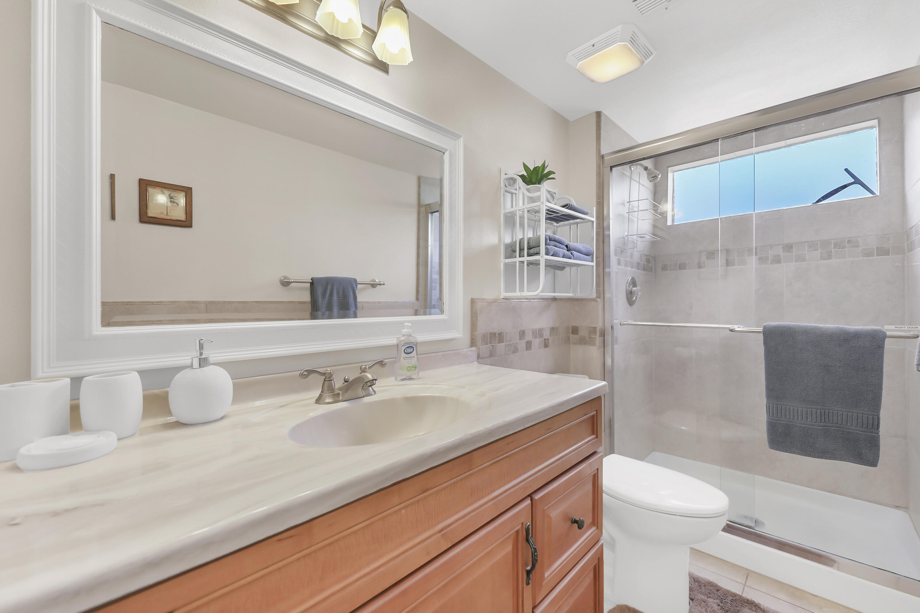 41476 Inverness Way Palm Desert, CA 92211 - Photo 17 of 37 a bathroom with a sink a toilet and shower