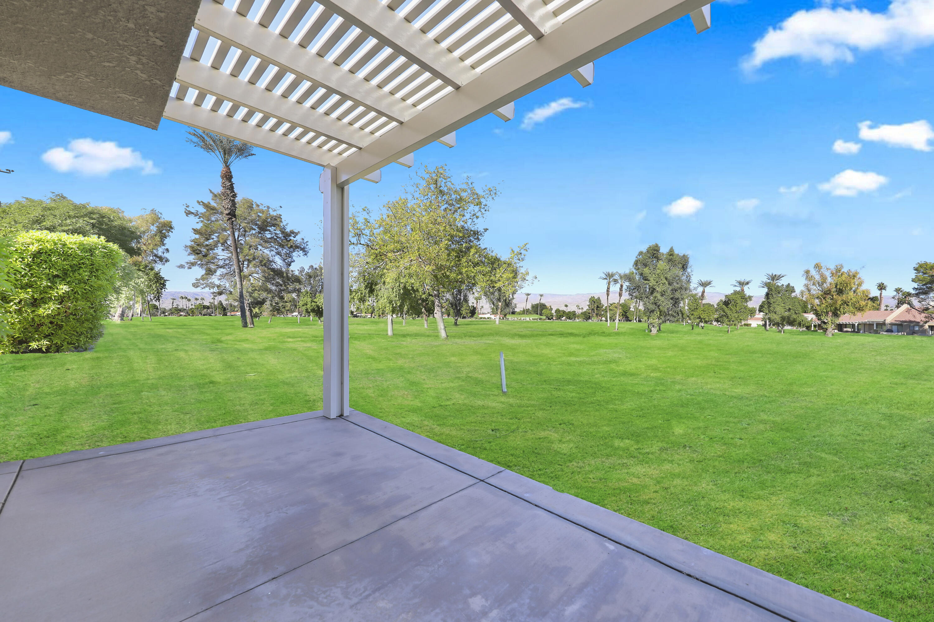 41476 Inverness Way Palm Desert, CA 92211 - Photo 19 of 37 a backyard of a house with lots of green space