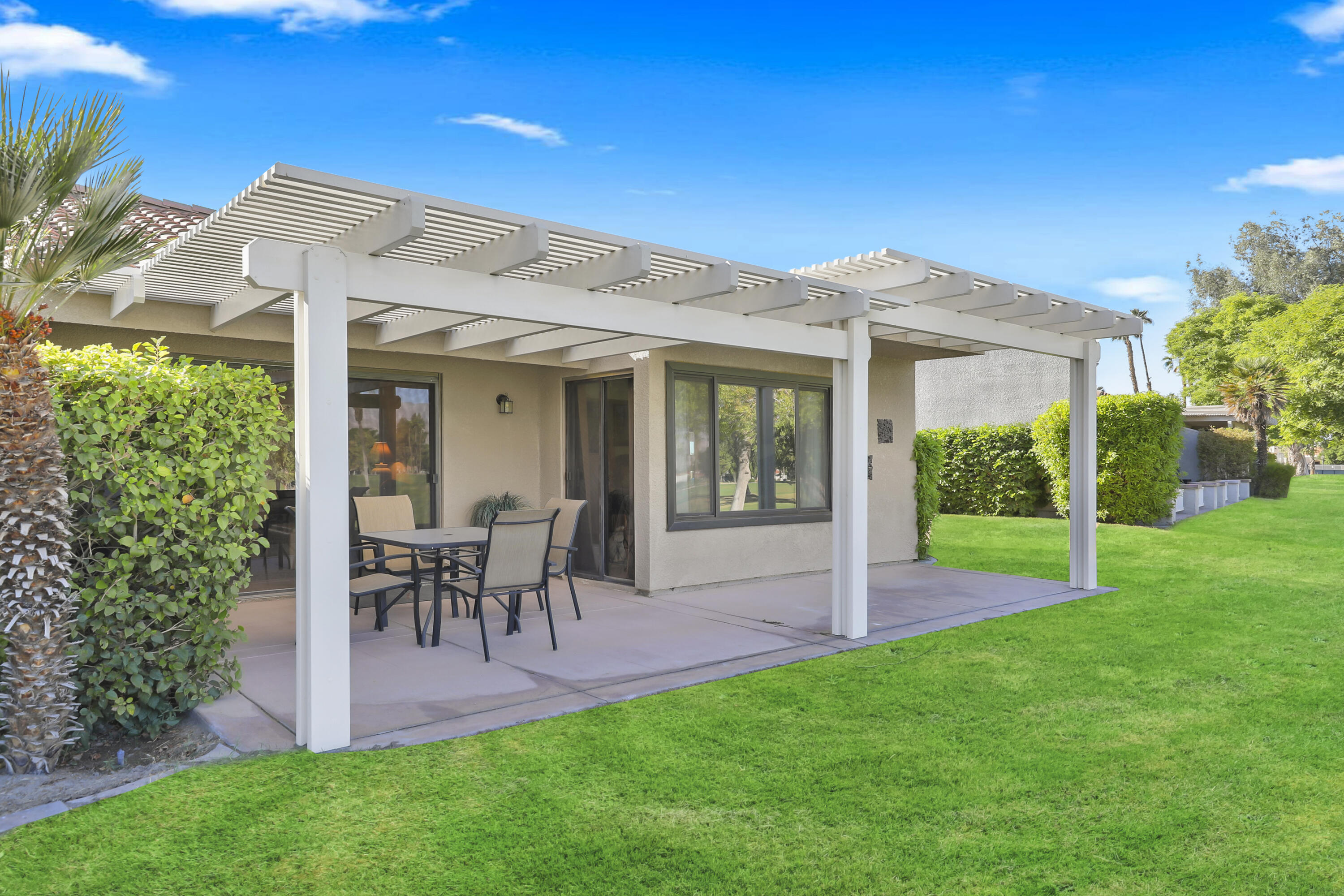 41476 Inverness Way Palm Desert, CA 92211 - Photo 20 of 37 a view of a house with a backyard porch and sitting area