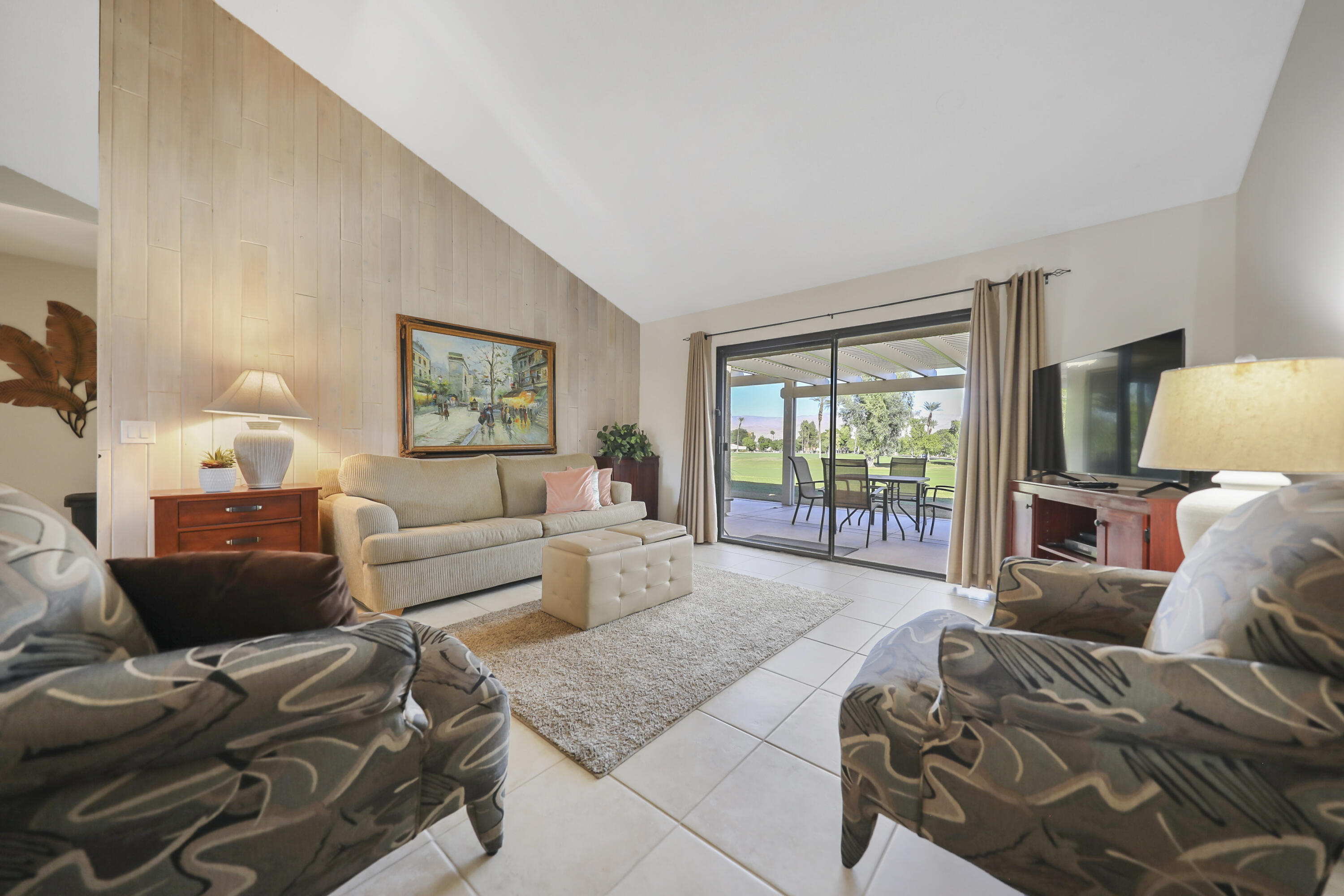 41476 Inverness Way Palm Desert, CA 92211 - Photo 2 of 37 a living room with furniture and a large window
