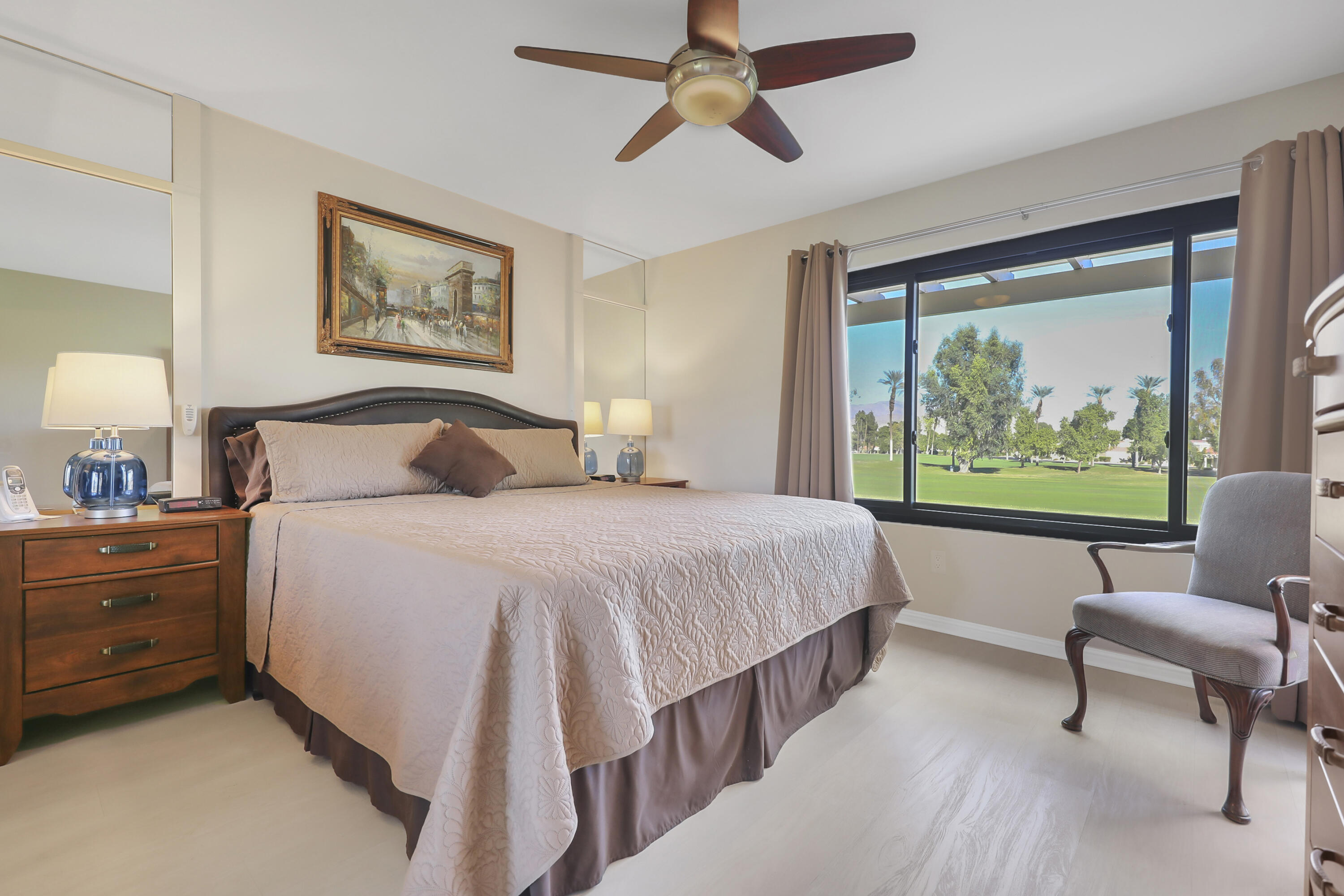 41476 Inverness Way Palm Desert, CA 92211 - Photo 4 of 37 a bedroom with a bed and a large window