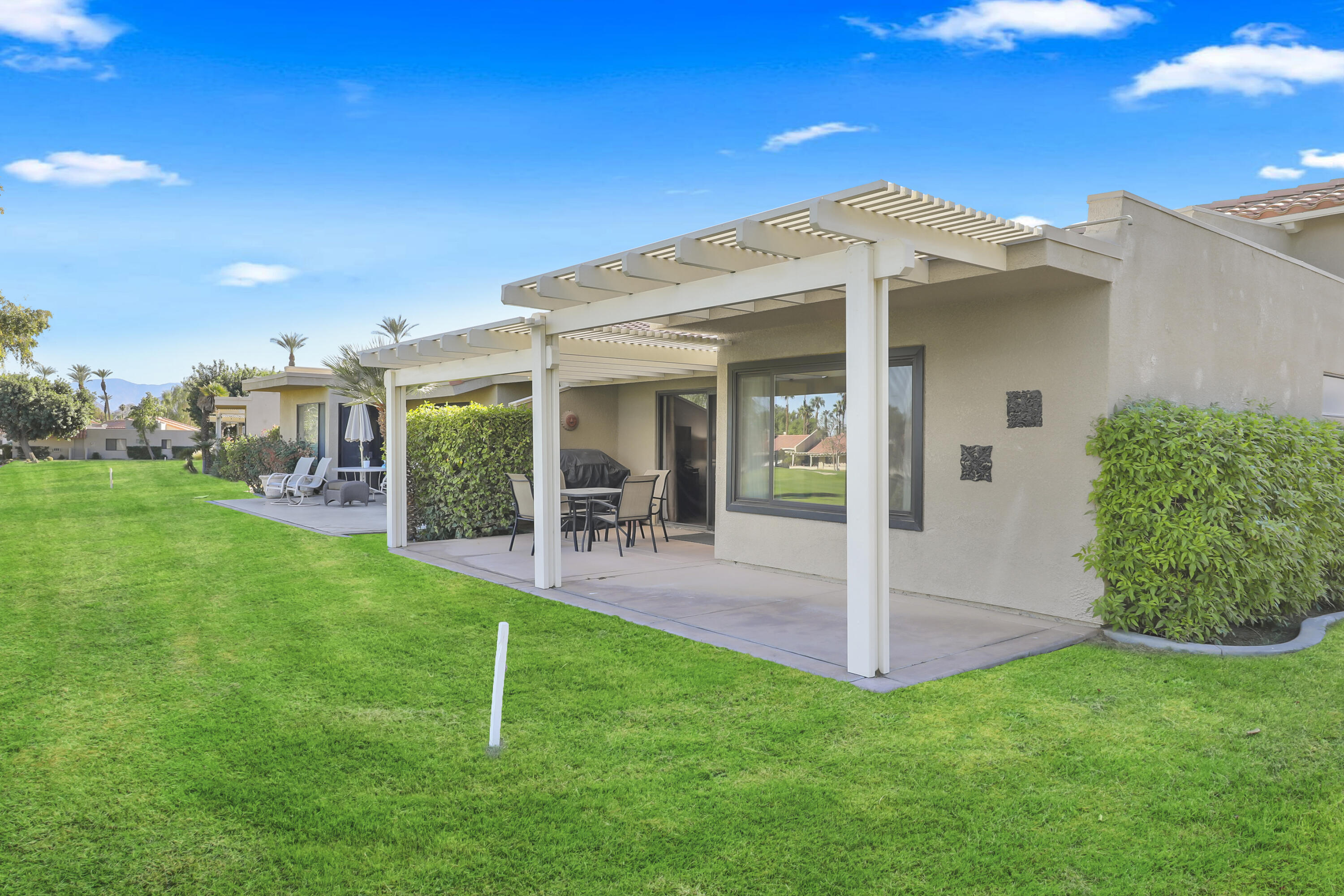 41476 Inverness Way Palm Desert, CA 92211 - Photo 6 of 37 a house view with a garden space