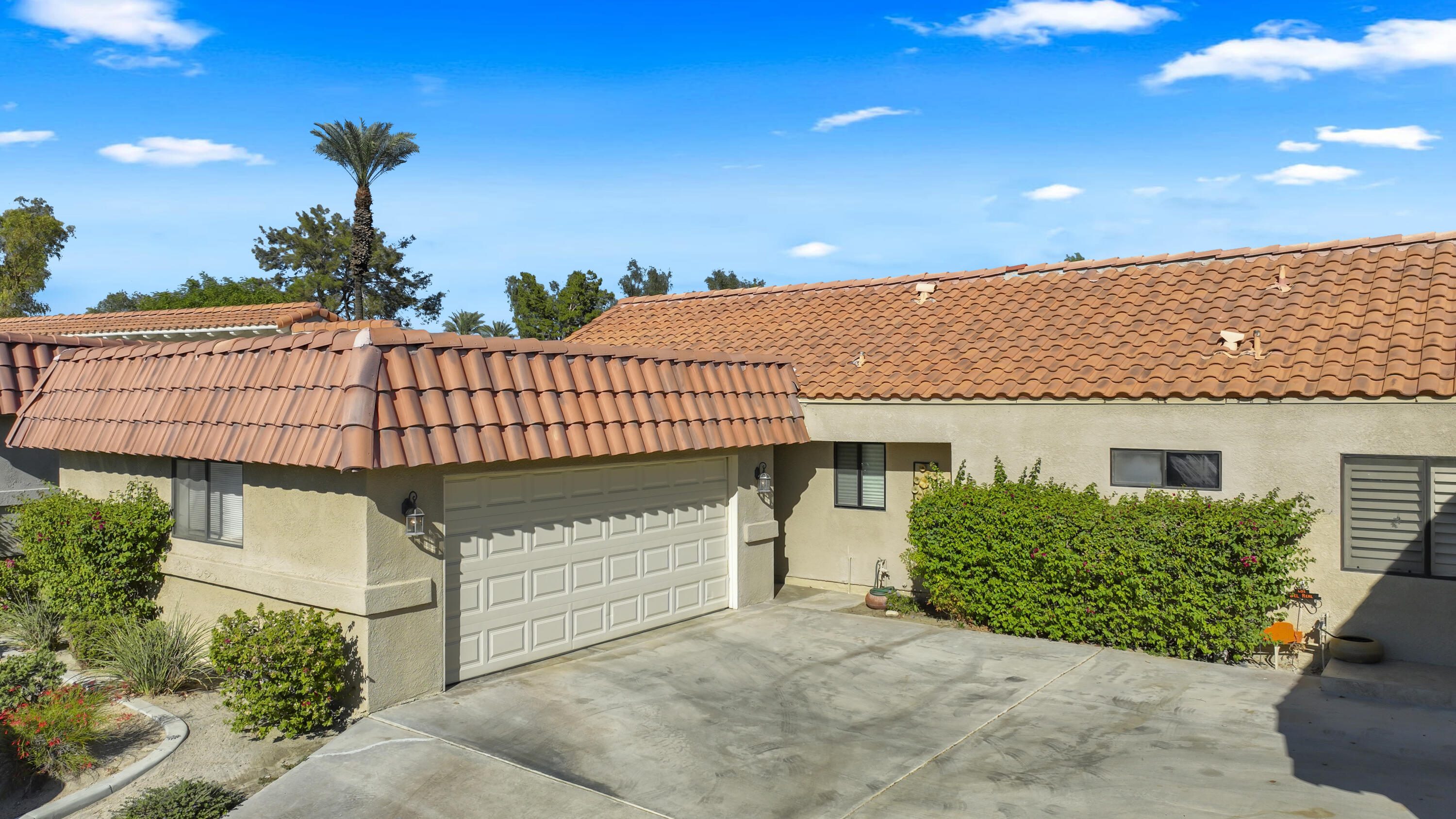 41476 Inverness Way Palm Desert, CA 92211 - Photo 7 of 37 a front view of a house with a garage