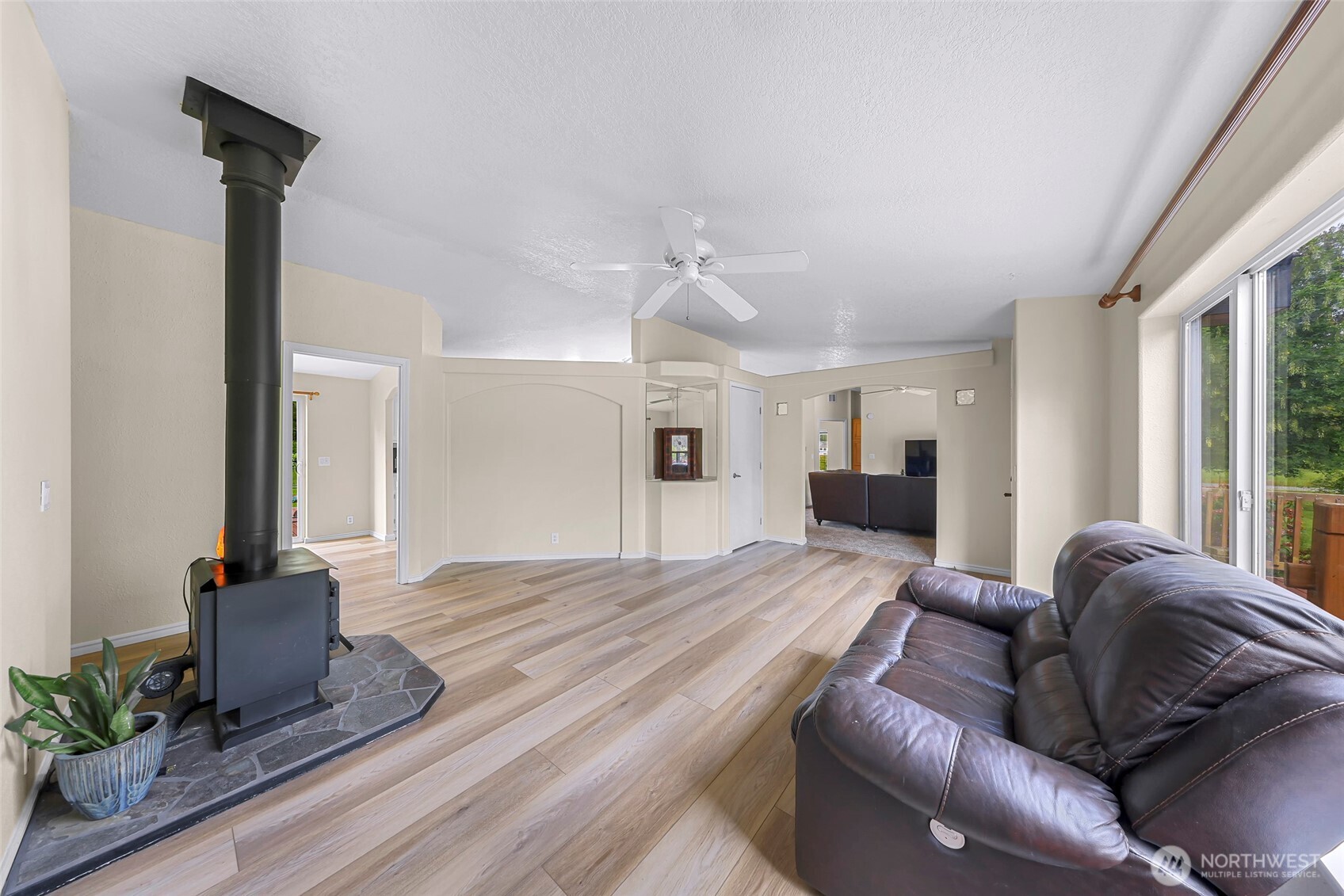 2957 Unick Road Ferndale, WA 98248 - Photo 8 of 39 a living room with furniture and a fireplace